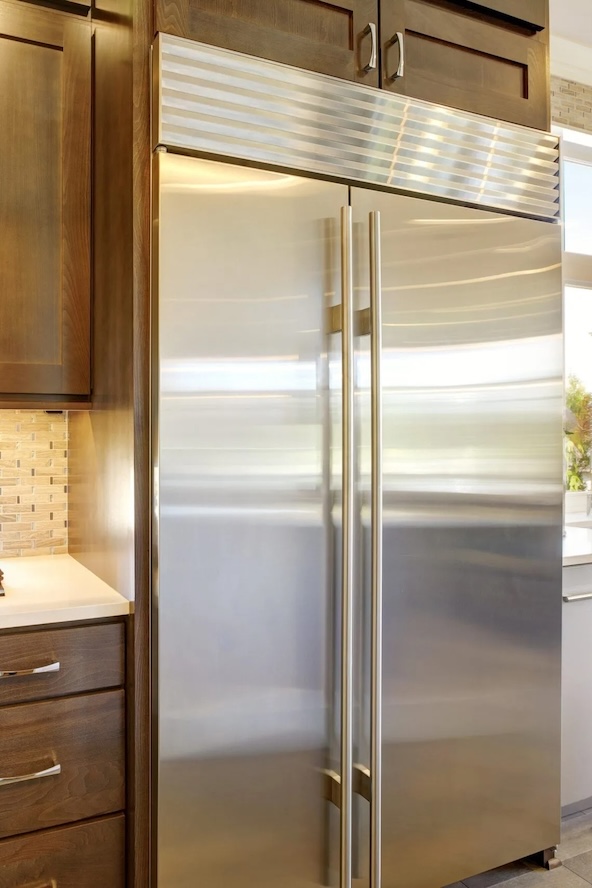 Refrigerator repair service in a Miami kitchen